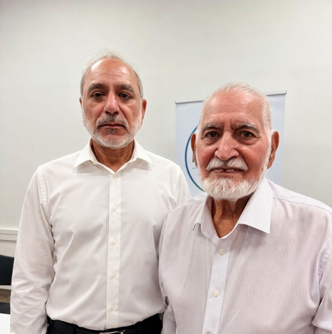Syed with community member